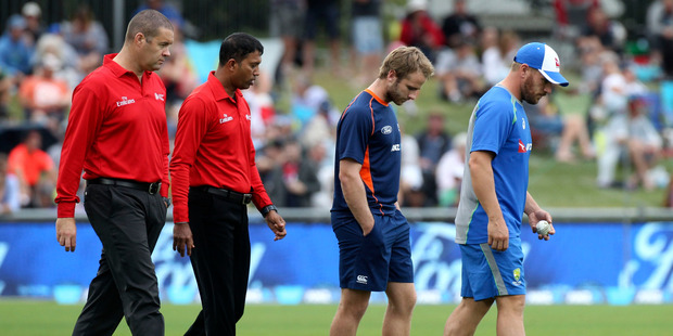 Left to right: Umpires Chris Brown and Kumar Dharmasena, Black Caps captain Kane Williamson and Australian captain Aaron Finch leave the field during the abandoned McLean Park ODI. Photo/Duncan Brown