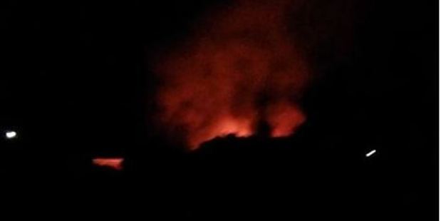 The night-time scene of a fierce blaze that extensively damaged a storage workshop at the Airborne Honey Farm in Leeston, Photo / Facebook