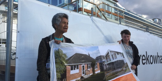 Glen Innes state house tenant Niki Rauti protests outside the opening of the $1.5 million art work dubbed: The Lighthouse. Photo / Simon Collins