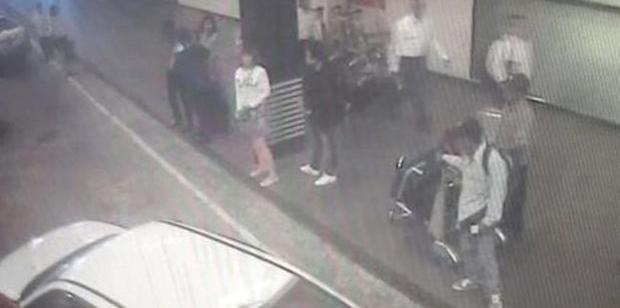 CCTV footage shows a woman (centre, in white) at Kuala Lumpur International Airport, who police say was arrested in connection with the death of Kim Jong-nam. Photo / AP
