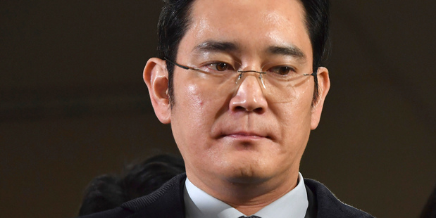 Lee Jae-yong arrives to be questioned as a suspect in a corruption scandal. Photo / AP
