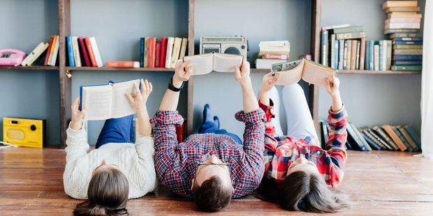Lying on the floor and trying to learn in a noisy environment is not ideal for kids. Photo / 123RF