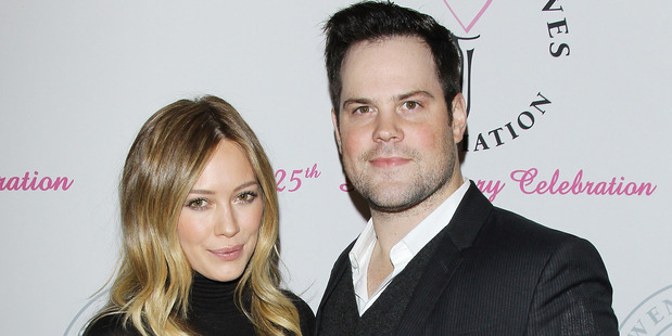 Hilary Duff pictured with Mike Comrie in 2013. Photo / Getty Images