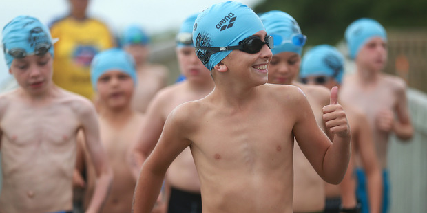Thumbs up: Weet-Bix Kids TRYathalon today in Point England Auckland. Pictured are competitors about to start the swim. Photo / Doug Sherring