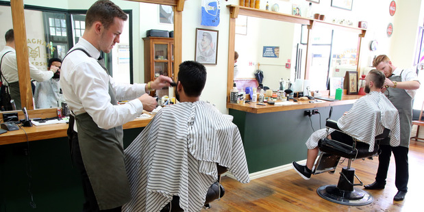 KEEPING IT OLD-SCHOOL: Former Cullinane College student Samuel Monaghan, left, is now running his own business.
PHOTO/ STUART MUNRO