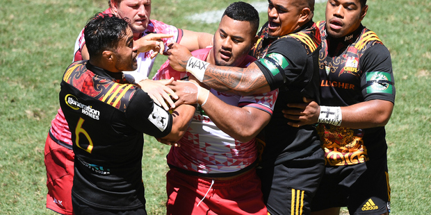 Chief players hold back Taniela Tupou after he headbutted Messam. Photo / photosport.co.nz