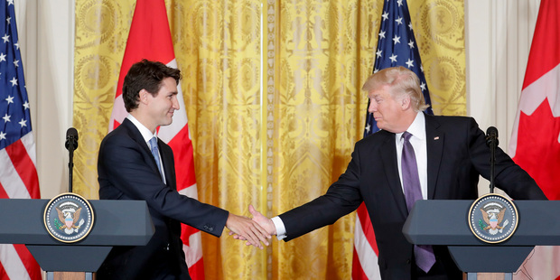 President Donald Trump and Canadian Prime Minister Justin Trudeau shake hands during a joint news conference in the East Room of the White House in Washington. Photo / AP