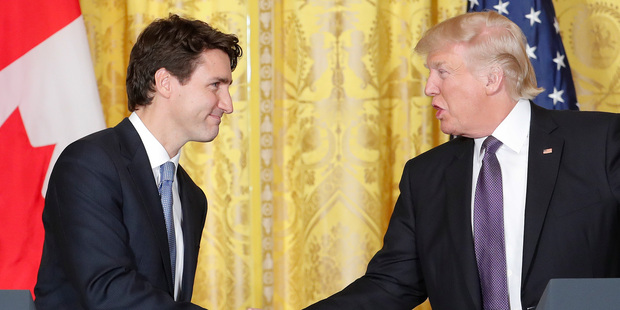 President Donald Trump and Canadian Prime Minister Justin Trudeau shake hands during a joint news conference in the East Room of the White House. Photo / AP