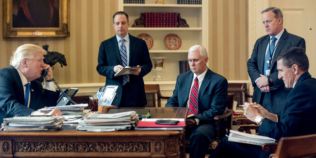Donald Trump accompanied by, from second from left, Chief of Staff Reince Priebus, Vice President Mike Pence, White House press secretary Sean Spice and and Michael Flynn. Photo / AP
