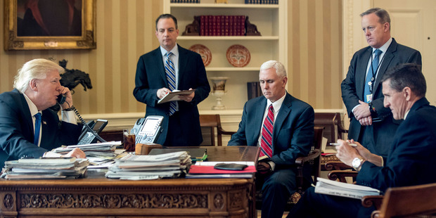 President Donald Trump, Vice President Mike Pence (middle), and National Security Adviser Michael Flynn (right). Flynn resigned as President Donald Trump's national security adviser Monday. Photo / AP