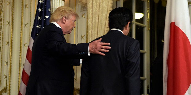 President Donald Trump, left, and Japanese Prime Minister Shinzo Abe, right, leave the room after making statements about the North Korean missile launch. Photo / AP