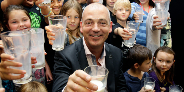 Fonterra chief executive Theo Spierings (centre) drinking milk with the kids at the announcement of Fonterra's Milk For Schools pilot scheme in 2011. Photo Sarah Ivey.