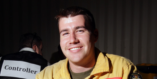 TUCKER TIME: Defence Force senior firefighter Cameron Turner from Linton enjoying the roast put on by the Hastings District Council, Civil Defence and Rapid Relief Team. PHOTO/PAUL TAYLOR.