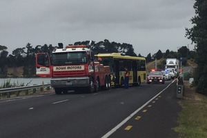 A bus involved in a crash on Maungatapu Bridge is about to be towed. Photo/George Novak