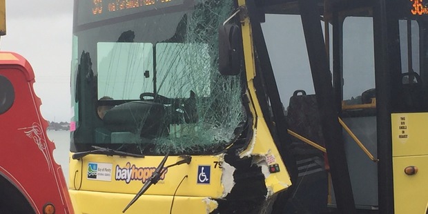 The bus involved in a crash at Maungatapu Bridge is towed. Photo/George Novak