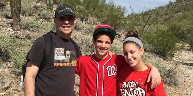 Noah Stern, center, appears with father Jonathan and sister Talia in late 2013. Jonathan was diagnosed with glioblastoma, an aggressive type of brain cancer, in 2015 and died last year. Photo / Courtesy of Noah Stern