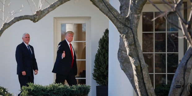 Mike Pence and Donald Trump are said to keep in close contact throughout the day but Trump kept him in the dark over Michael Flynn. Photo / AP