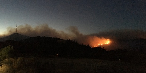 The fire worsened overnight and large flames are visible from several kilometres away. Photo / Joshua Price