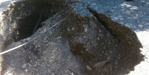 The large 3m wide sinkhole which appeared yesterday in a Punakaiki neighbourhood. Photo / Westport News