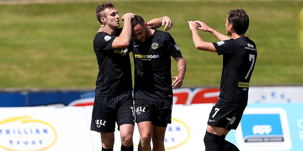 Tom Jackson (C) of Team Wellington celebrates a goal. Photo / Photosport