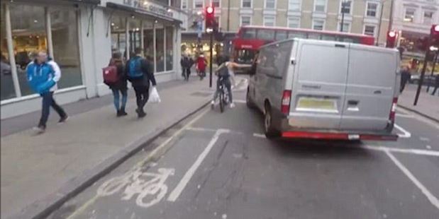 Female cyclist rips off van mirror after sexist taunts