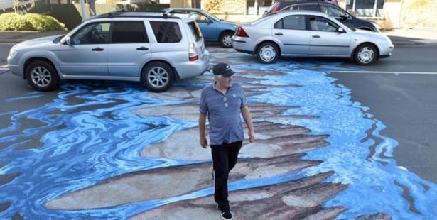 The paintings create an optical illusion, appearing 3-D to motorists while being flat to pedestrians. Photo / Otago Daily Times