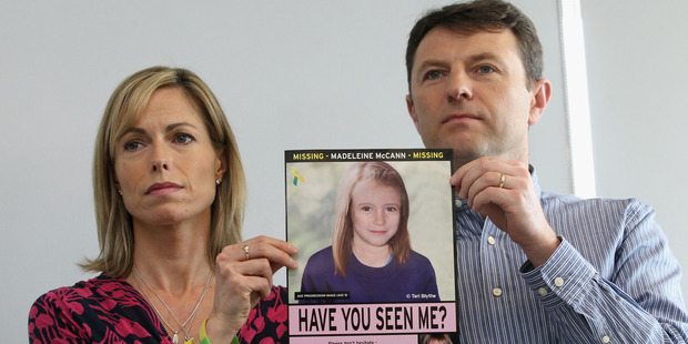 Kate and Gerry McCann hold an age-progressed police image of their daughter. Photo / Getty Images