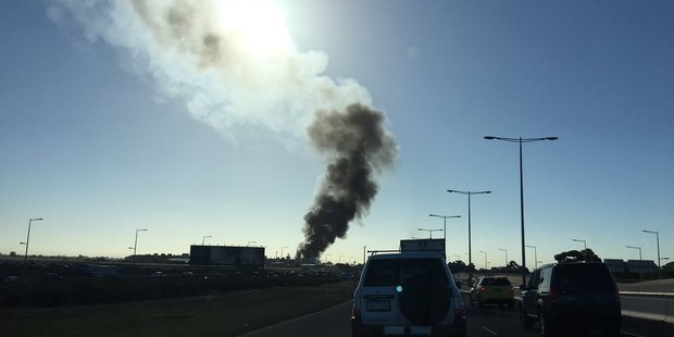 Black smoke coming from Essendon airport in Melbourne. Photo / Twitter / @sam_amjadali