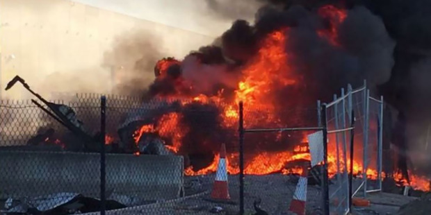 Flames from the scene of the crashed plane at Essendon. Photo / Jordan Fouracre