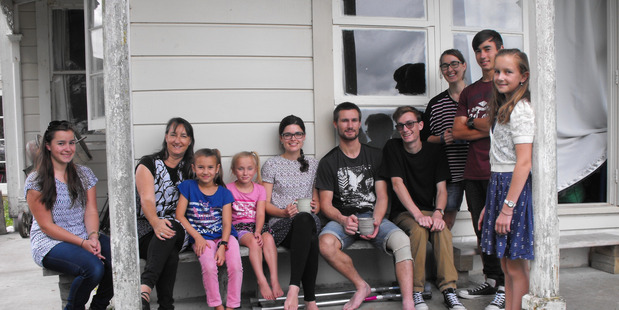 The Arthur family from left: Shantae, Marie, Brontie, Kayla, Hayley Smith, (Nick's fiancée) Nick, Caleb, Brianna, Josiah and Sophia. Missing is dad Blair and eldest daughter Caitlin. PHOTO/LIN FERGUSON