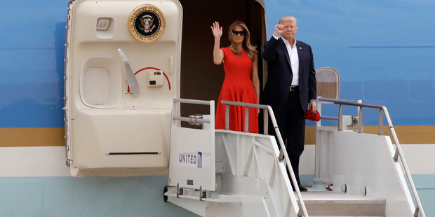 President Donald Trump and his wife, first lady Melania Trump, arrive on Air Force One. Photo / AP