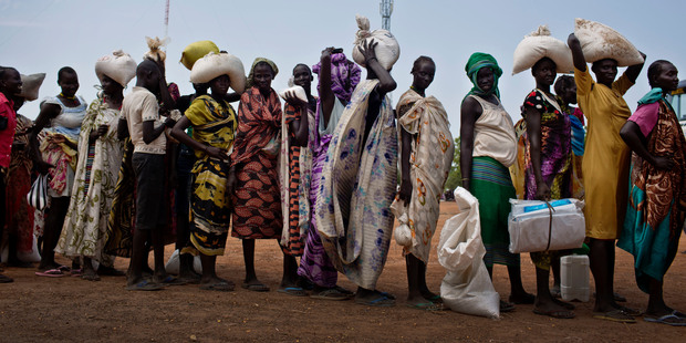Women who fled fighting in nearby Leer in recent months, queue for food aid at a food distribution made by the World Food Programme in Bentiu, South Sudan. Photo / AP