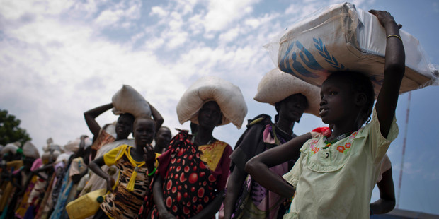 In this photo taken October 19, 2016 and released by UNICEF, a young girl queues for food aid at a food distribution made by the World Food Programme in Bentiu, South Sudan. Photo / AP