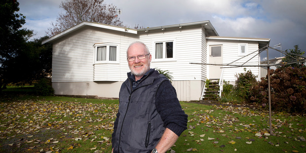 Rusty Kane at the council-owned house that has sat empty for about 18 months behind Brookfield retirement village. Photo/file