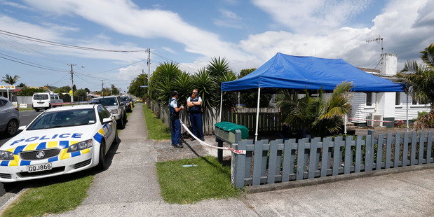 Police investigate a scene on Kamo Rd following a gang-related shooting on Clark Rd. PHOTO/JOHN STONE