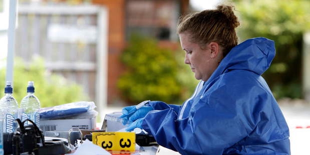 Environment Scientific Research forensic officers examine the scene on Kamo Rd. PHOTO/JOHN STONE.