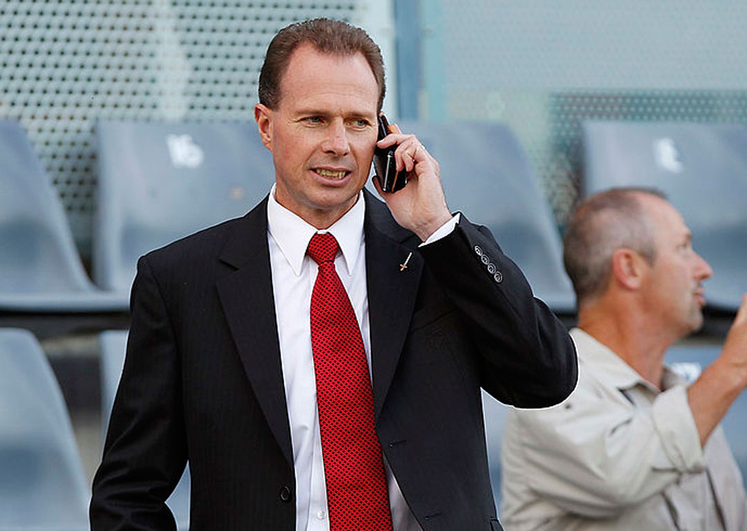 'Come on Richie, get the boots back on'. Crusaders CEO Hamish Riach talks on his phone. Photo /Getty