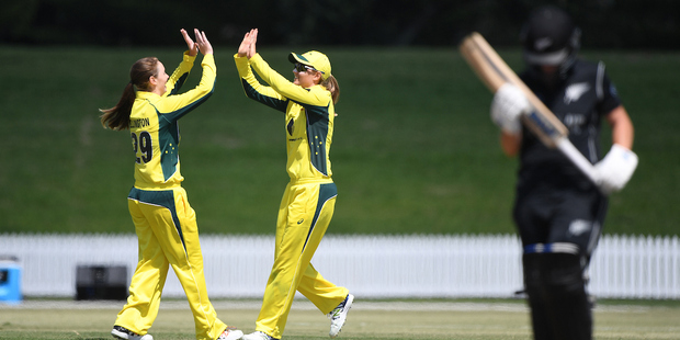 Meg Lanning takes a catch to dismiss Katey Martin as she celebrates with bowler Amanda-Jade Wellington. Photo / Photosport