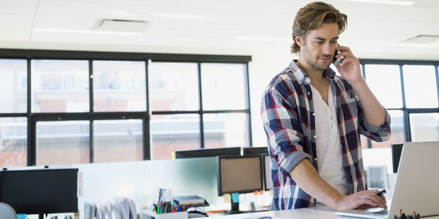 Standing desks may be part of the solution. Photo / Getty
