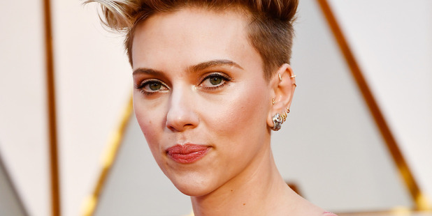 Actor Scarlett Johansson was not impressed with Ryan Seacrest's question on the red carpet at the Oscars. Photo / Getty