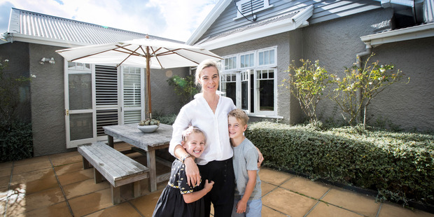 Property owner Emma Main with her children Scarlet, 5, and Henry, 7, at their new home on Mainston Road in Remuera. Photo / Jason Oxenham