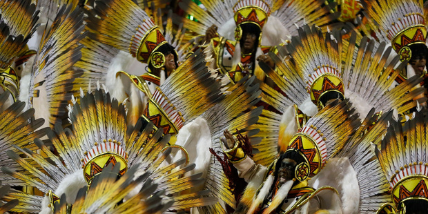 Performers from the Academicos do Grande Rio samba school parade during Carnival celebrations at the Sambadrome in Rio de Janeiro. Photo / AP