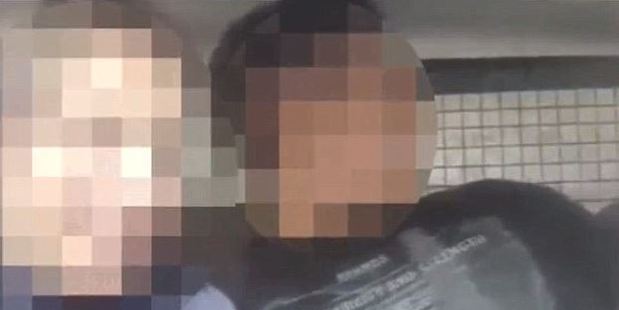 Two unnamed police officers from Rosario, Argentina, were seen getting intimate in a patrol vehicle. Photo / Youtube