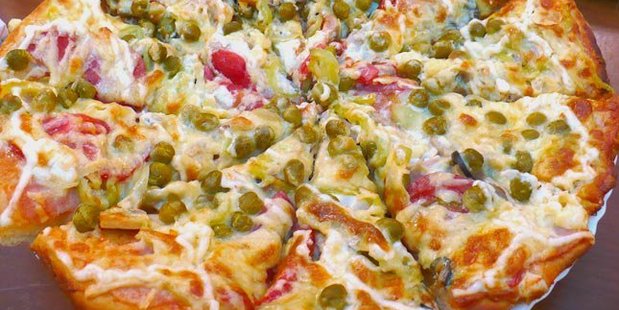 The interesting pizza topping combo: peas and mayo. Would you try it? Photo / Twitter, Air-ic