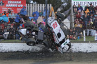 Daryl Hughes and Chris Bagrie somersault through the air after rain fell during racing at Stratford Speedway on Boxing Night.