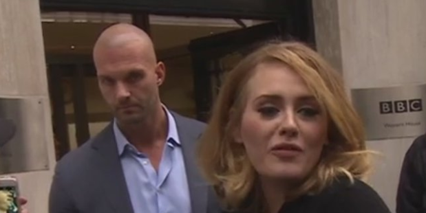 Adele's bodyguard Peter Van der Veen has garnered his own following online after appearing by her side. Photo / Getty