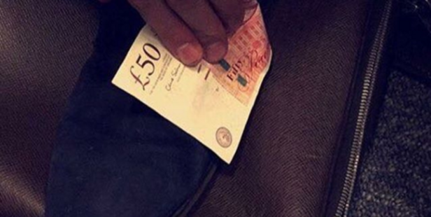 Cleaning shoes with £50 notes. The caption reads "When a peasant touches your shoes." Photo / Instagram