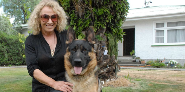 Sue Oomen with her German shepherd Bruza, who she nursed back to health after he contracted tetanus when he was three months old. Photo / Emily Norman