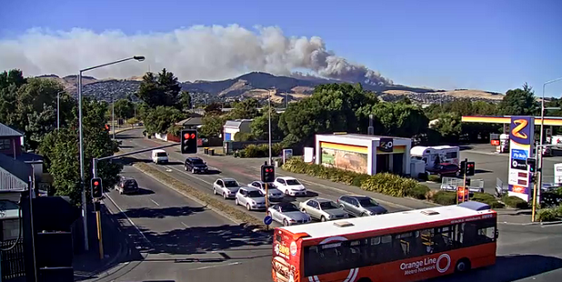 Smoke billows from two wildfires burning on the tinder-dry Port Hills near Christchurch. Photo / CTOC