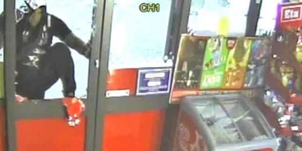 The man was captured on security cameras climbing through a broken window and walking about in the Wallacetown Lorneville Highway Super Liquor. Photo / NZ Police